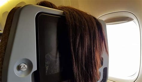 airline passenger shames woman for rudely hanging hair over back of seat