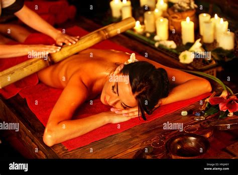 Bamboo Massage Of Woman In Spa Salon Interior Oriental Therapy Stock