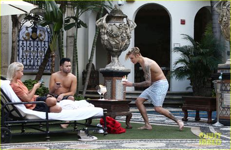 justin bieber goes shirtless for a swim at the versace