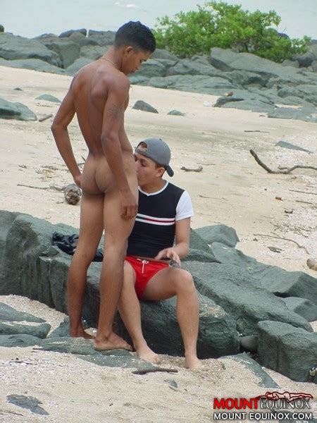 two cute twinks at the beach sucking cock and fondling each other