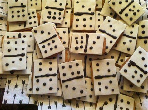 white  black dominos  laying  top     brown dots