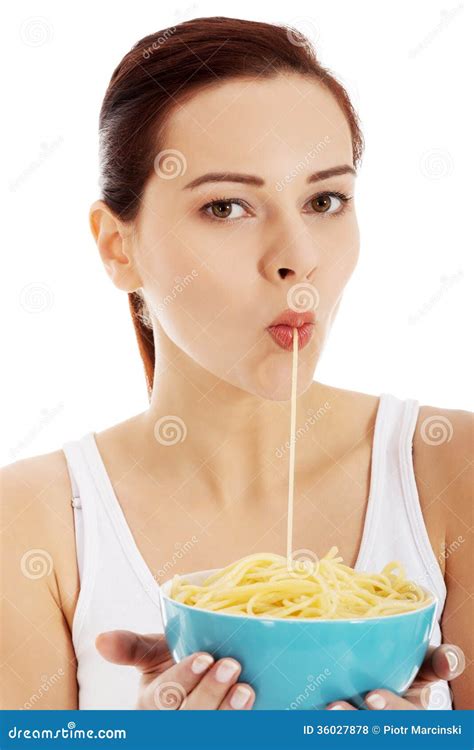 young beautiful woman eating pasta   bowl stock photo image