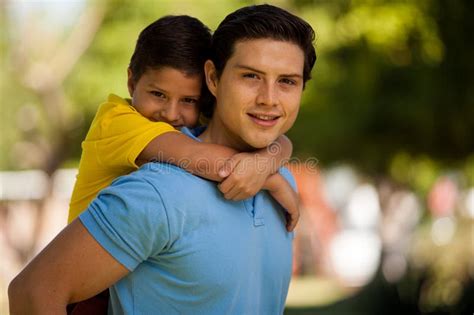 son  father holding  son high res stock photo
