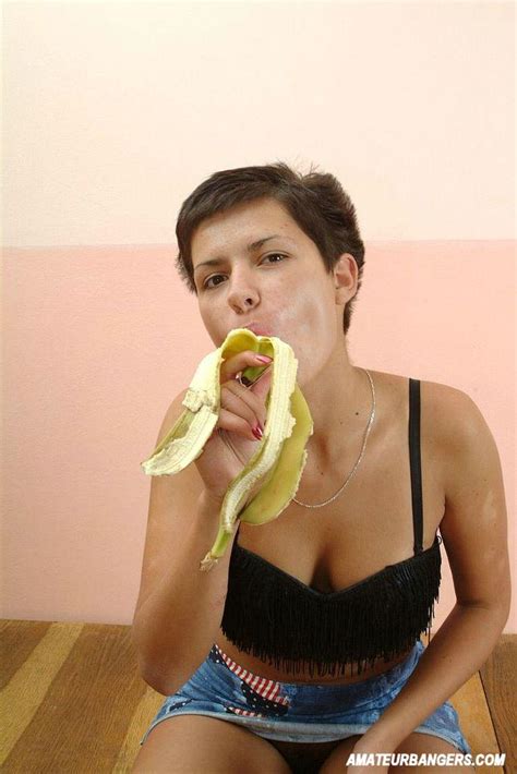 short haired girl peels banana with her sweet lips 2356