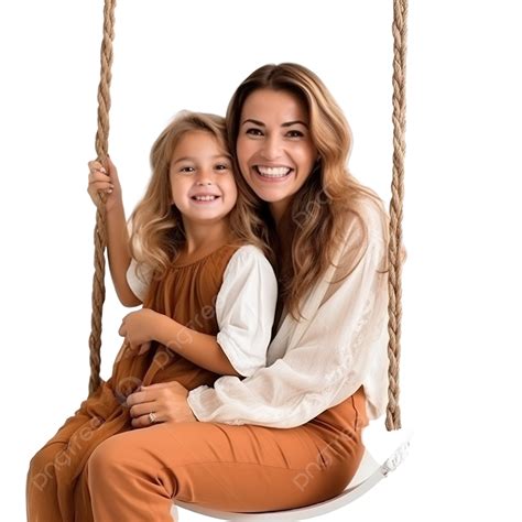 Young Mother And Daughter Sitting On Swing Next To Pumpkin Halloween