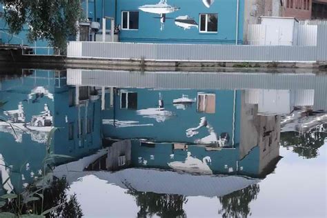 upside down mural reflects its true self on the water