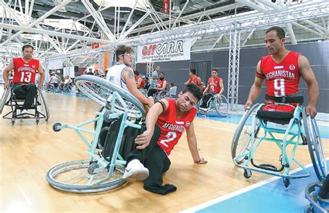 hussaini sayed mohammad a member of the afghan national wheelchair basketball team falls during