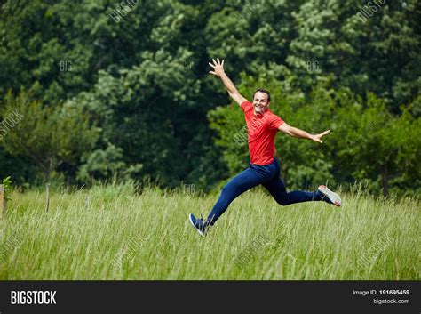 happy man jumping joy image photo  trial bigstock