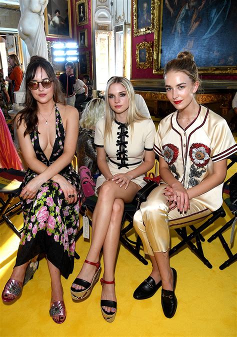 dakota johnson has a gorgeous sisters date shows plenty of cleavage in