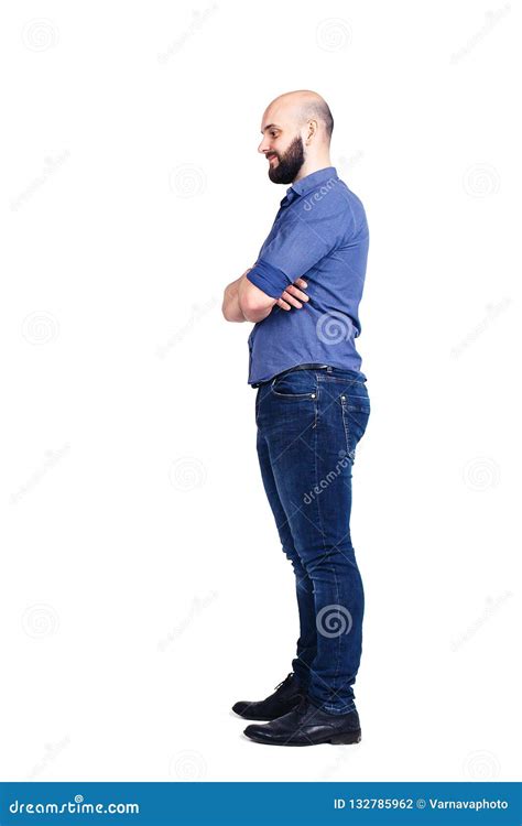 A Young Bearded Guy Stands Sideways And Looking Down Isolated On White