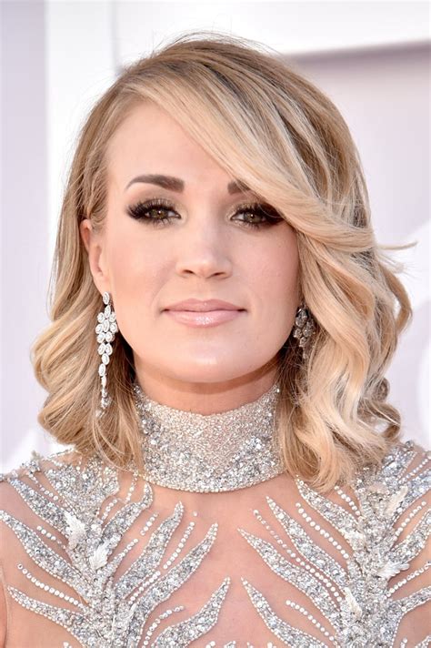 check out those bright diamond earrings carrie underwood s dress at
