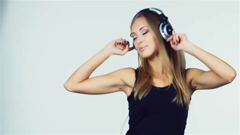 crazy beautiful rock and roll girl on headphones dancing