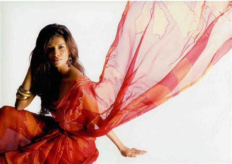sri lankan chula  glorious   wind swept oranje saree  woman superhero glorious