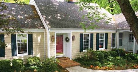tan house black shutters and red doors on pinterest
