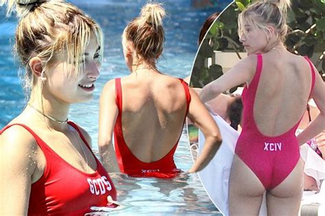 hailey baldwin wears sexy red swimsuit and shows off her peachy bum at