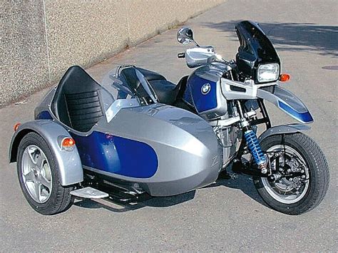 silver  blue motorcycle parked    building