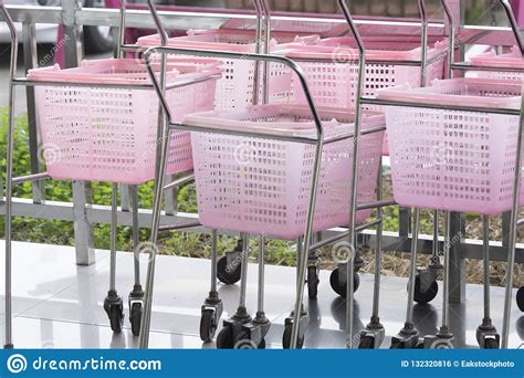 shopping carts pink color   retail department store stock photo image  group purchase