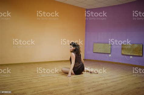 Curly Brunette Plus Size Model Doing Acrobatic At Dance Room Stock