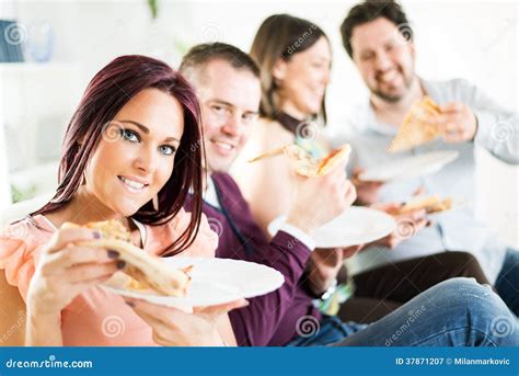 cheerful friends eating pizza royalty  stock photography image