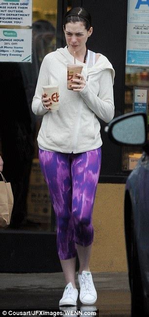 Anne Hathaway Slips Into Bright Purple Workout Leggings In The Middle