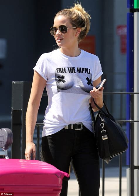 simone holtznagel arrives back in australia wearing racy free the nipple t shirt daily mail