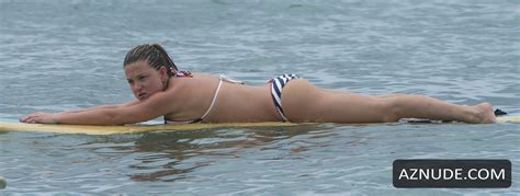 zara holland shows off her sexybikini body during a surfing class in