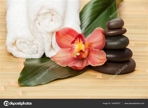 spa background white towels on exotic plant beautiful orchid flower