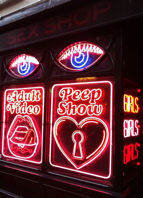 peep show neon outside a mexican restaurant in old compton street compton street london soho