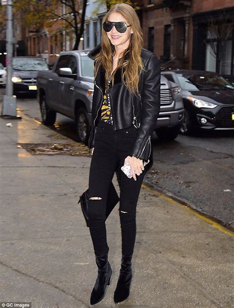 gigi hadid flashes a radiant smile in leather and denim as