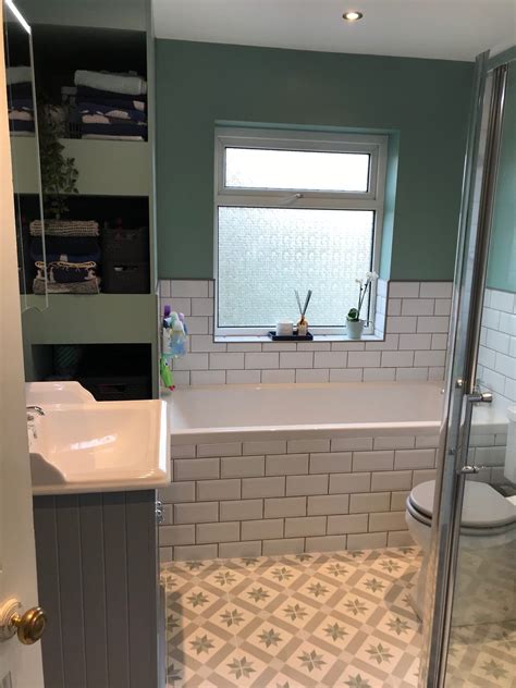 Traditional Bathroom With White Metro Tiles And Patterned Floor Tiling