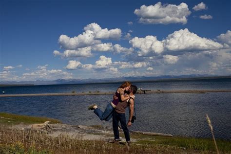 yellowstone national park couple takes kissing photos