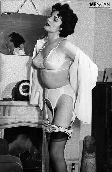 stocking clad gal shows her hairy muff in retro black n white pix