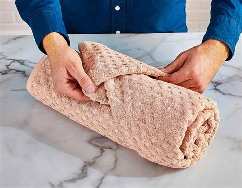 How To Fold Towels Like A Fancy Hotel Better Homes And Gardens