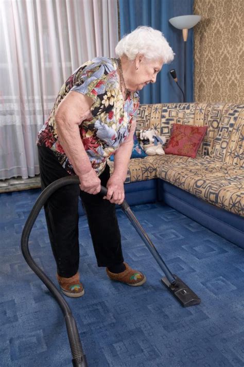 elderly woman cleaning carpet vivid cleaning