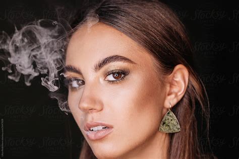 Model With Elegant Make Up Smoking By Stocksy Contributor Liliya