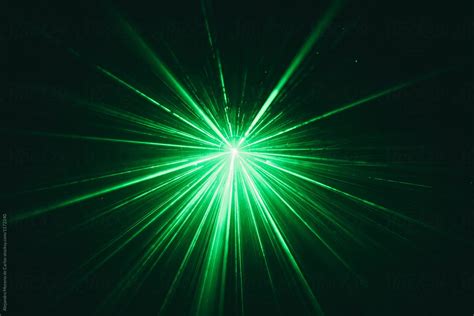 green laser beam  black dark background  stocksy contributor