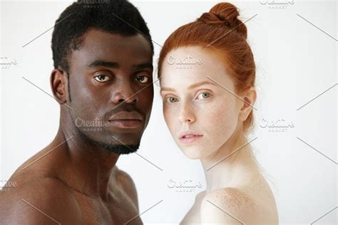black and white headshot of african man and caucasian woman standing