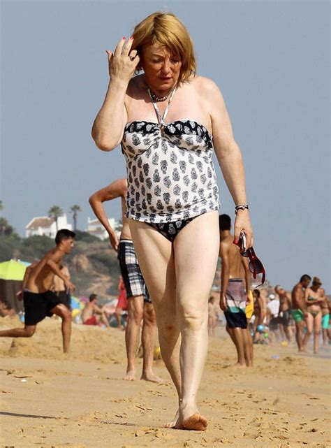 kellie maloney flaunts her new figure in skimpy tankini on the beach in portugal celebrity