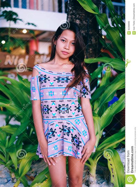 attractive beautiful asian girl with long hair posing on