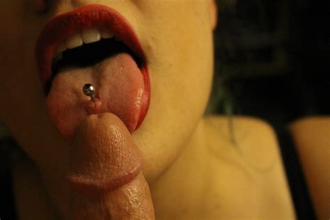 Red Lipstick And Tongue Piercing Licking Tip Of Cock Porn
