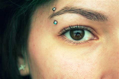 eyebrow piercing information care pain healing time