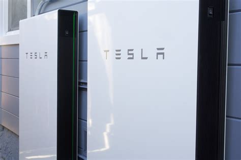 photo featuring  tesla powerwall  mounted   side   house