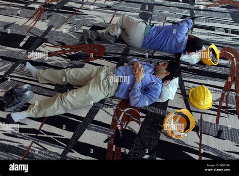 dubai united arab emirates construction workers sleeping   break   floor stock