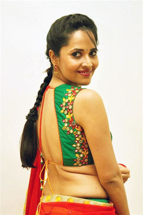 tv anchor anasuya in yellow half saree at telugu film audio launch tollywood stars