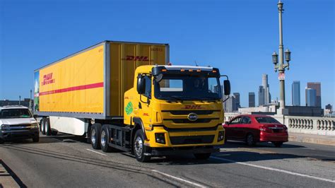 dhl expands green fleet  launch  electric tractor trailer vehicles   dhl united