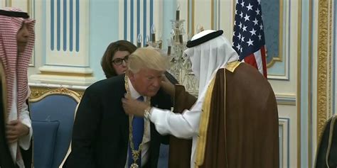 donald trump appears  bow  saudi arabian king  receiving gold