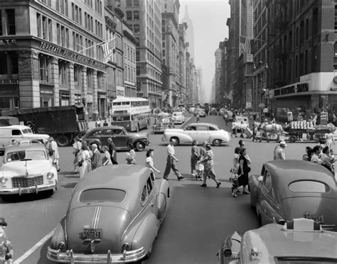 1940s 1950s street scene crowds traffic intersection fifth avenue and 14