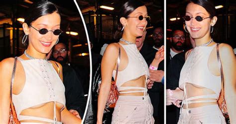 bella hadid flashes major underboob as she goes braless in tiny crop