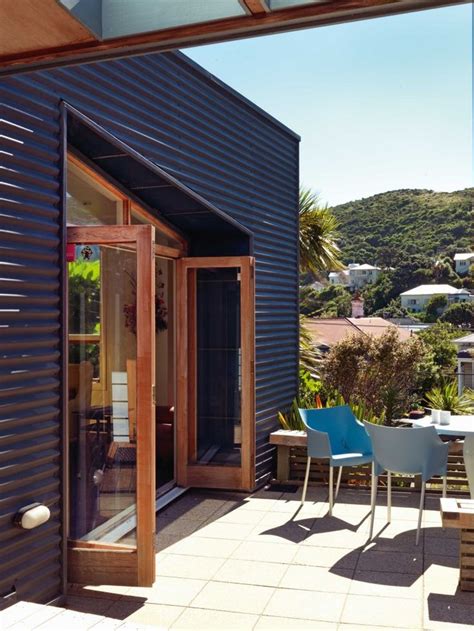 painted corrugated iron exterior walls flank  outdoor
