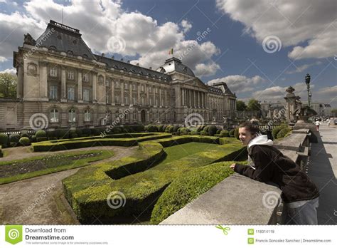 teen girl next to the royal palace with its gardens in brussels capital of belgium stock image